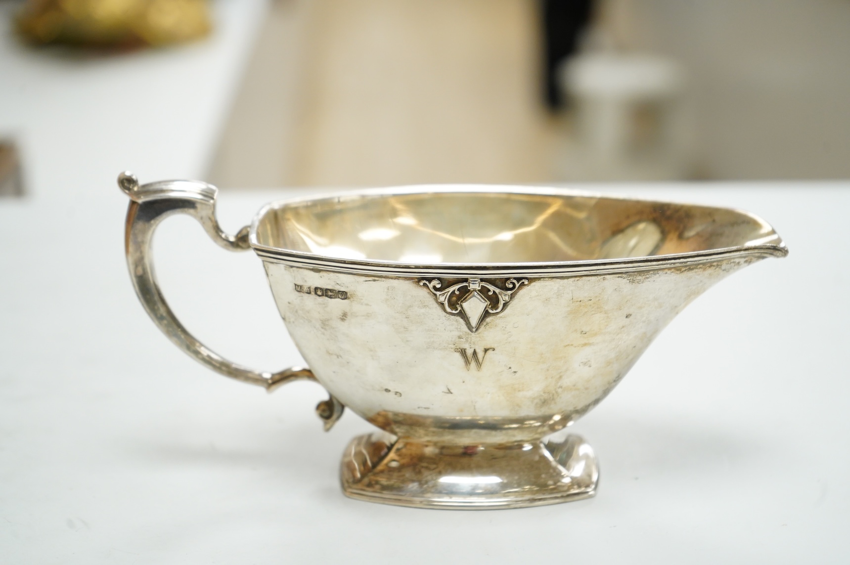 A George VI silver sauceboat by Mappin & Webb, Sheffield, 1938, with engraved initial, length 20cm, 6.9oz.